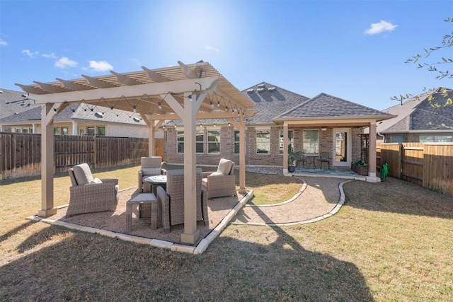 rear view of property featuring a yard, a fenced backyard, a pergola, a patio area, and brick siding