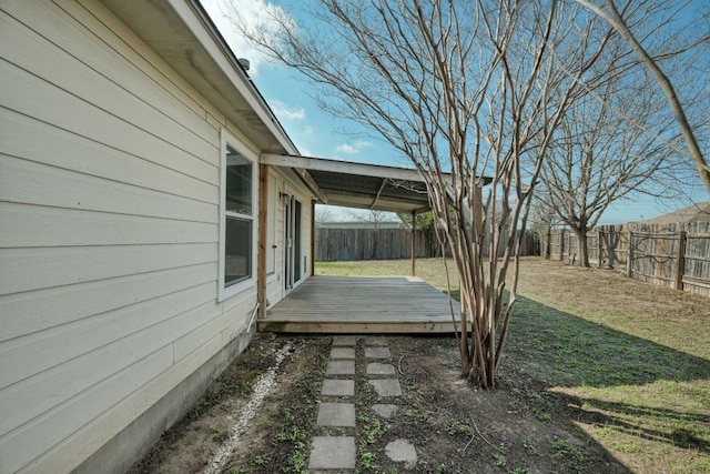 view of yard featuring a fenced backyard and a wooden deck