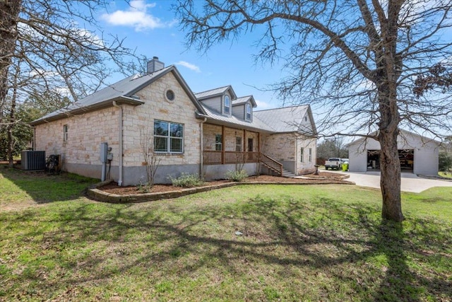 view of property exterior featuring stone siding, central AC, a yard, an outdoor structure, and a chimney