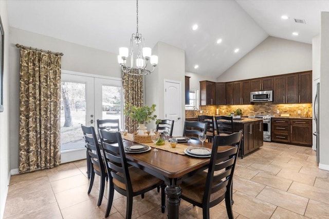 dining space with french doors, plenty of natural light, visible vents, and an inviting chandelier