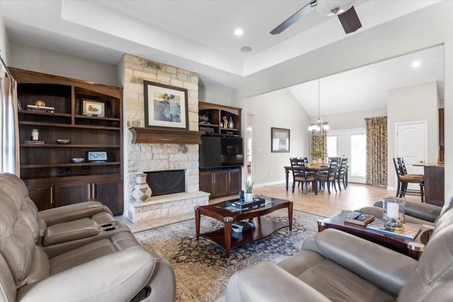 tiled living room featuring lofted ceiling, ceiling fan with notable chandelier, recessed lighting, a stone fireplace, and baseboards