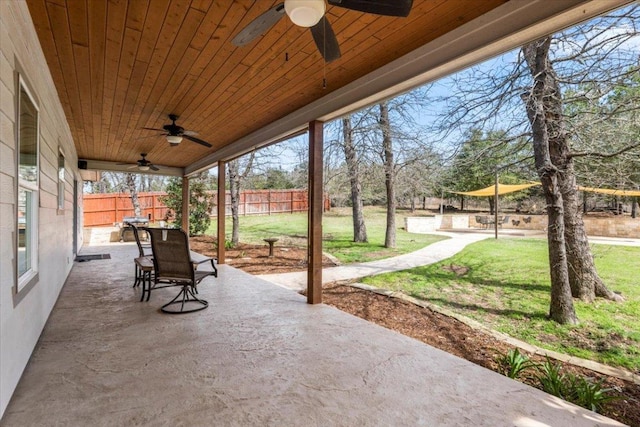 view of patio / terrace with fence and ceiling fan