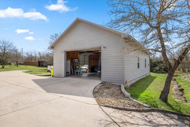 detached garage featuring driveway