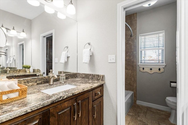 bathroom featuring baseboards, toilet, shower / tub combination, tile patterned floors, and vanity