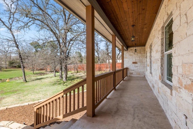 view of patio with a porch and fence