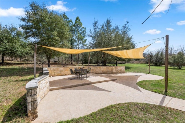 view of home's community featuring a lawn and volleyball court