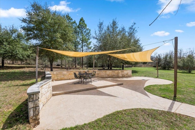 151 William Higgins Dr, Bastrop, TX 78602 - view of community featuring a yard and a patio area