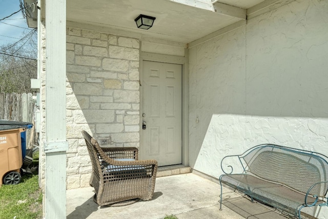 doorway to property with stone siding