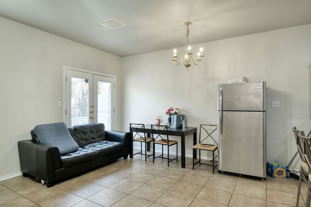 living area featuring visible vents, french doors, light tile patterned flooring, baseboards, and a chandelier