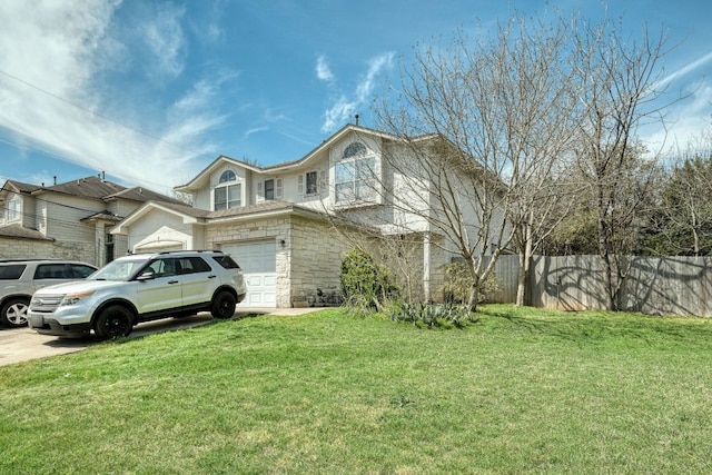 view of front facade with a front lawn, stone siding, fence, concrete driveway, and an attached garage