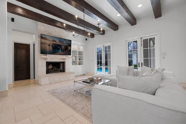 living area with beam ceiling, a fireplace, tile patterned flooring, french doors, and a notable chandelier