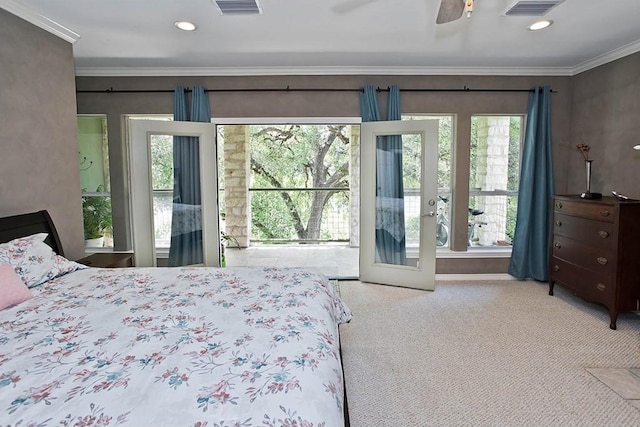 bedroom with visible vents, crown molding, ceiling fan, and carpet floors