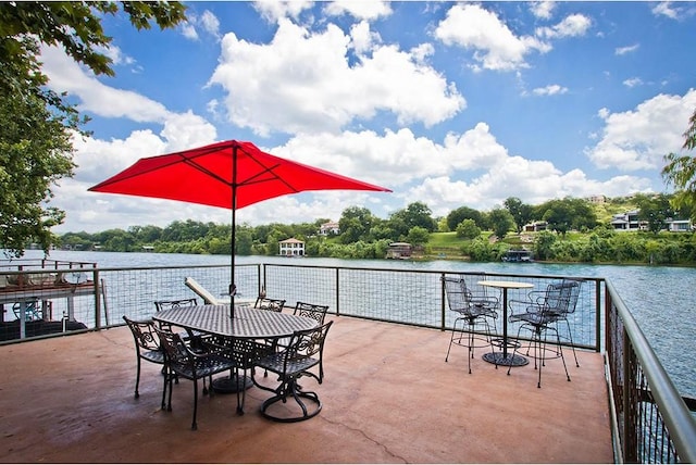 view of patio with a water view