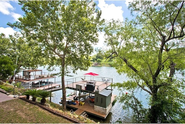 view of dock featuring boat lift and a water view