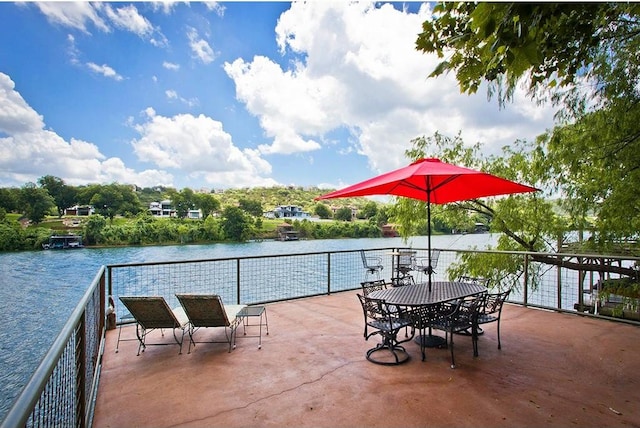 view of patio with a water view