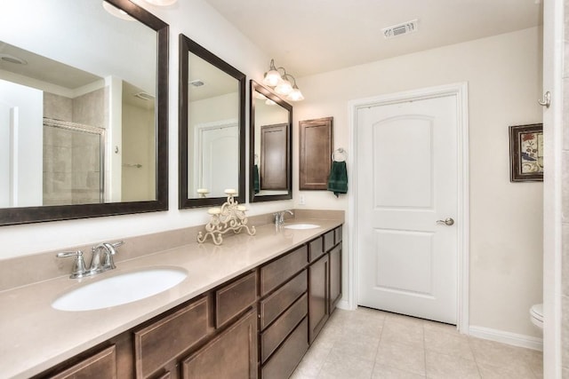 705 Kitty Hawk Rd, Georgetown, TX 78633 - full bathroom with baseboards, tile patterned flooring, a sink, and visible vents