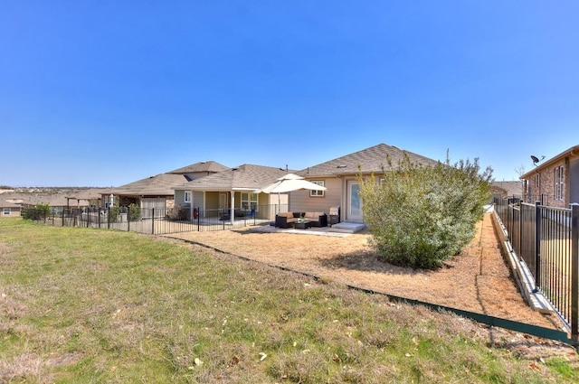 705 Kitty Hawk Rd, Georgetown, TX 78633 - back of property with a patio area, a lawn, a fenced backyard, and an outdoor living space