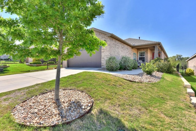705 Kitty Hawk Rd, Georgetown, TX 78633 - view of property hidden behind natural elements with a front lawn, concrete driveway, fence, brick siding, and an attached garage