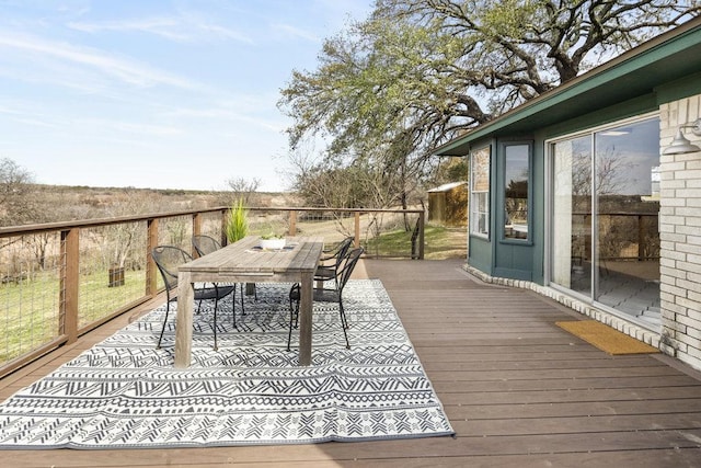 wooden deck with outdoor dining area