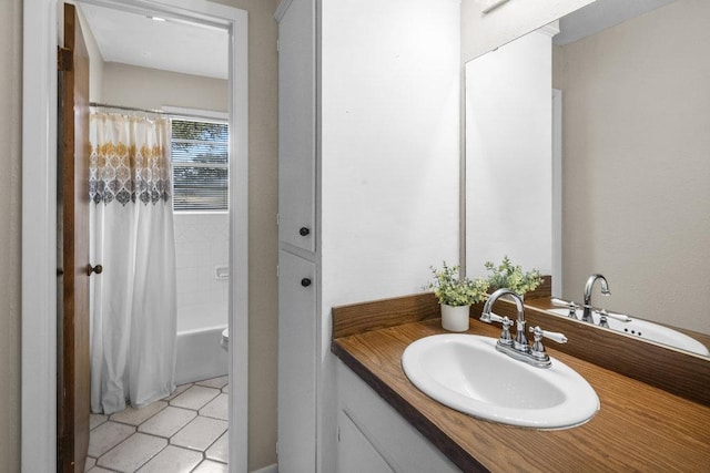 full bath featuring shower / bathtub combination with curtain, vanity, and tile patterned flooring