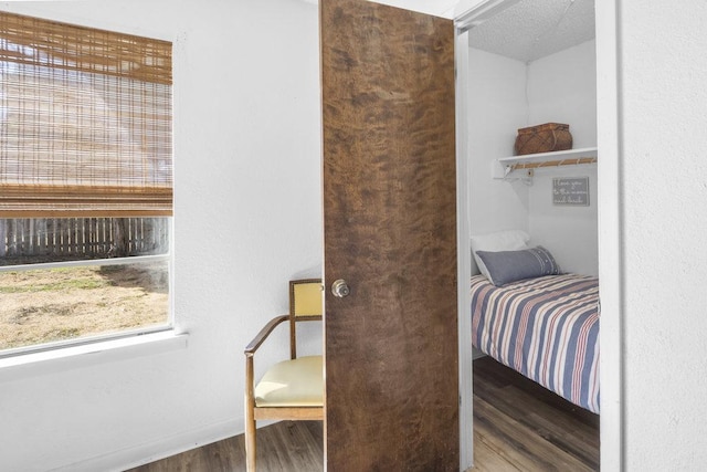 bedroom with wood finished floors