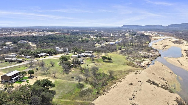 birds eye view of property with a mountain view