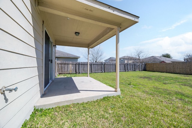 view of yard with a patio area and a fenced backyard