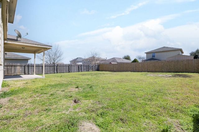 view of yard with a fenced backyard