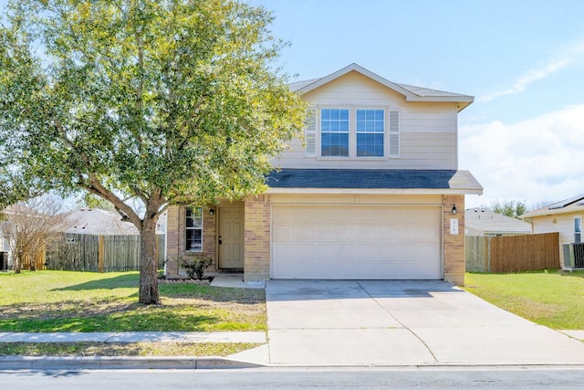 traditional home with brick siding, driveway, a front yard, and fence