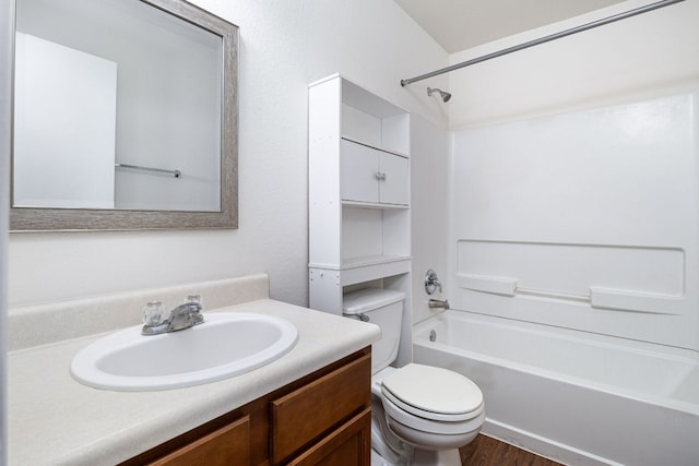 full bath with vanity, shower / bathing tub combination, toilet, and wood finished floors