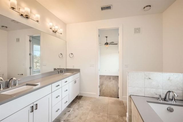 bathroom with ceiling fan, tile patterned floors, visible vents, and a sink