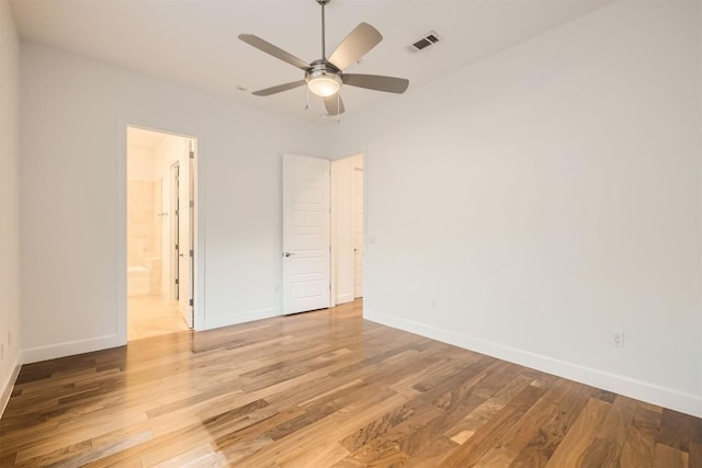 unfurnished room with visible vents, baseboards, light wood-style floors, and ceiling fan