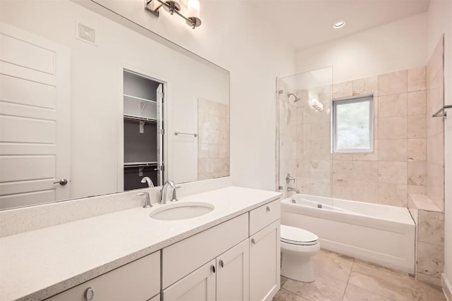 full bathroom featuring visible vents, washtub / shower combination, toilet, tile patterned floors, and vanity