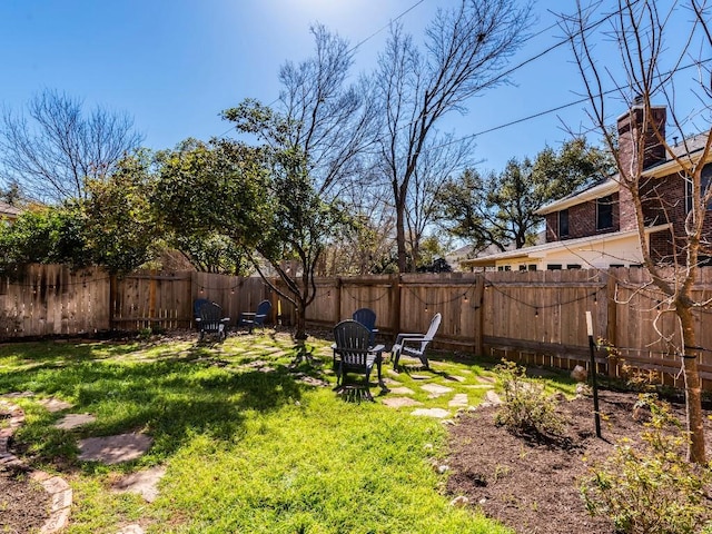 view of yard featuring a fenced backyard