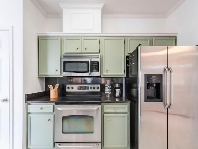 kitchen with appliances with stainless steel finishes, green cabinets, and crown molding