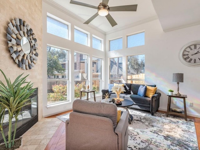 sunroom with a ceiling fan