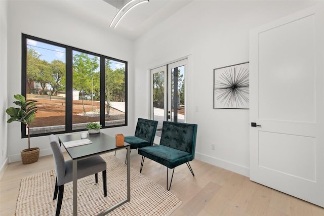 interior space with light wood finished floors and baseboards