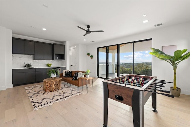 rec room featuring recessed lighting, visible vents, light wood-style floors, and a ceiling fan