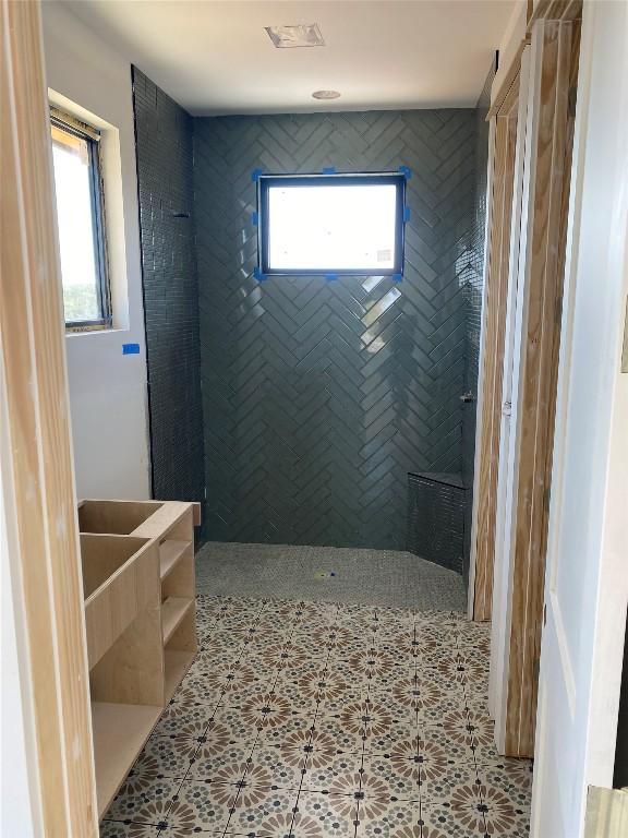 bathroom with tile patterned floors