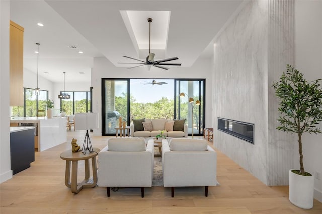 8112 Kuhn Dr, Austin, TX 78736 - living area with light wood-style floors, a fireplace, ceiling fan, and recessed lighting