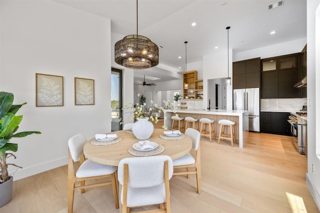 8112 Kuhn Dr, Austin, TX 78736 - dining area with light wood-style floors, recessed lighting, and a ceiling fan