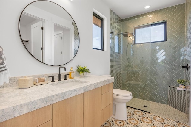 8112 Kuhn Dr, Austin, TX 78736 - full bathroom with vanity, tiled shower, toilet, tile patterned flooring, and recessed lighting
