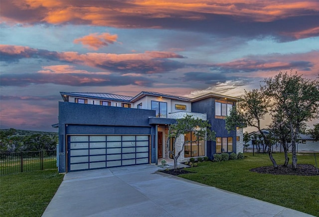 8112 Kuhn Dr, Austin, TX 78736 - contemporary house featuring driveway, stucco siding, and a garage