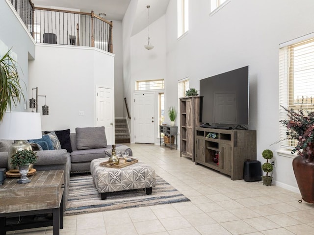 tiled living room featuring a wealth of natural light and stairway