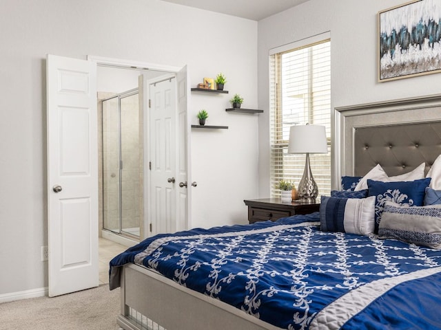 bedroom featuring baseboards and carpet