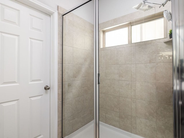 full bath with a shower stall