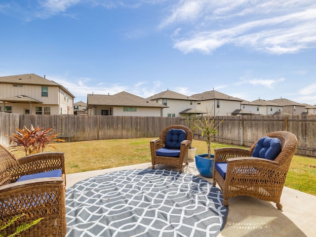 view of patio with a residential view and a fenced backyard