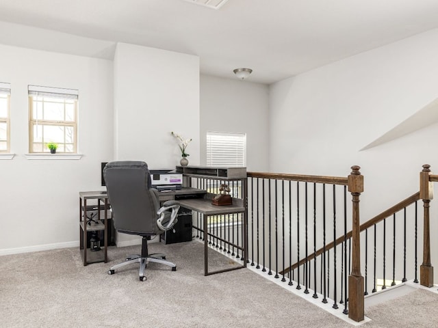 office space with baseboards and carpet