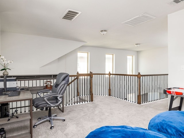 office space with visible vents and carpet