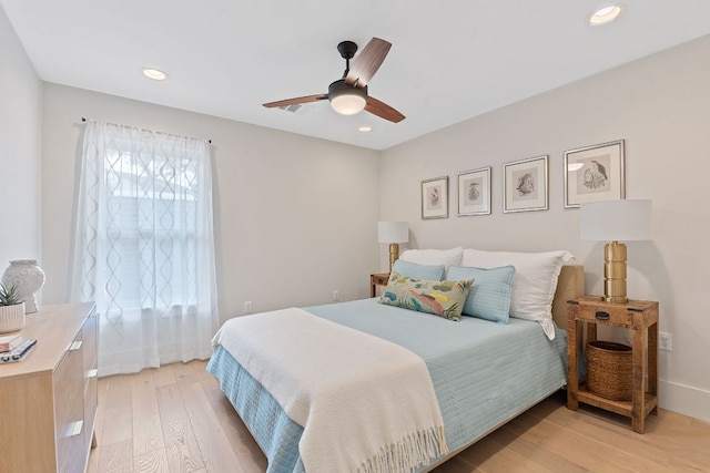 bedroom featuring light wood-style flooring, recessed lighting, baseboards, and ceiling fan